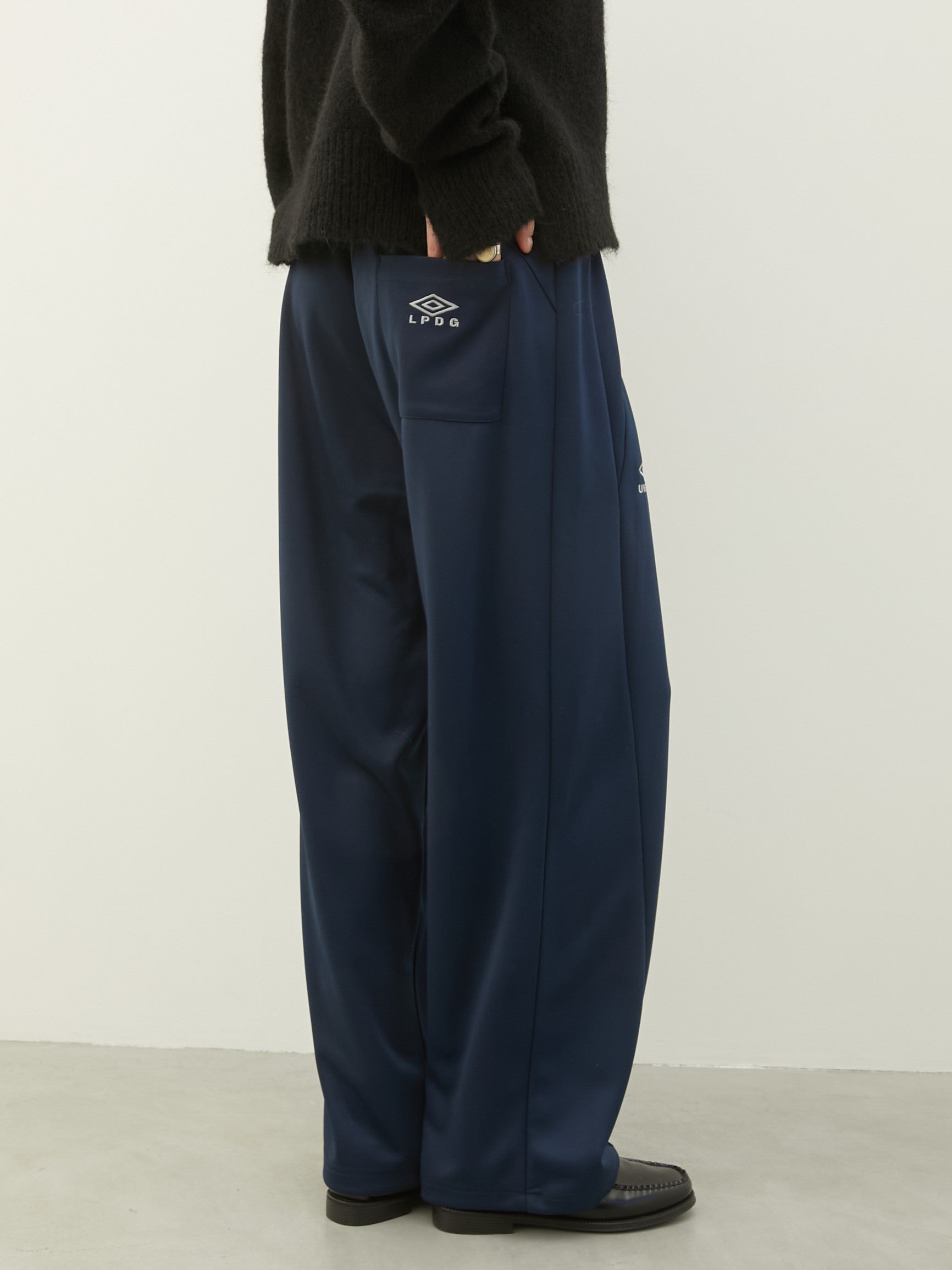 UMBRO×LA PEAU DE GEM The Urban Nomad track Pants