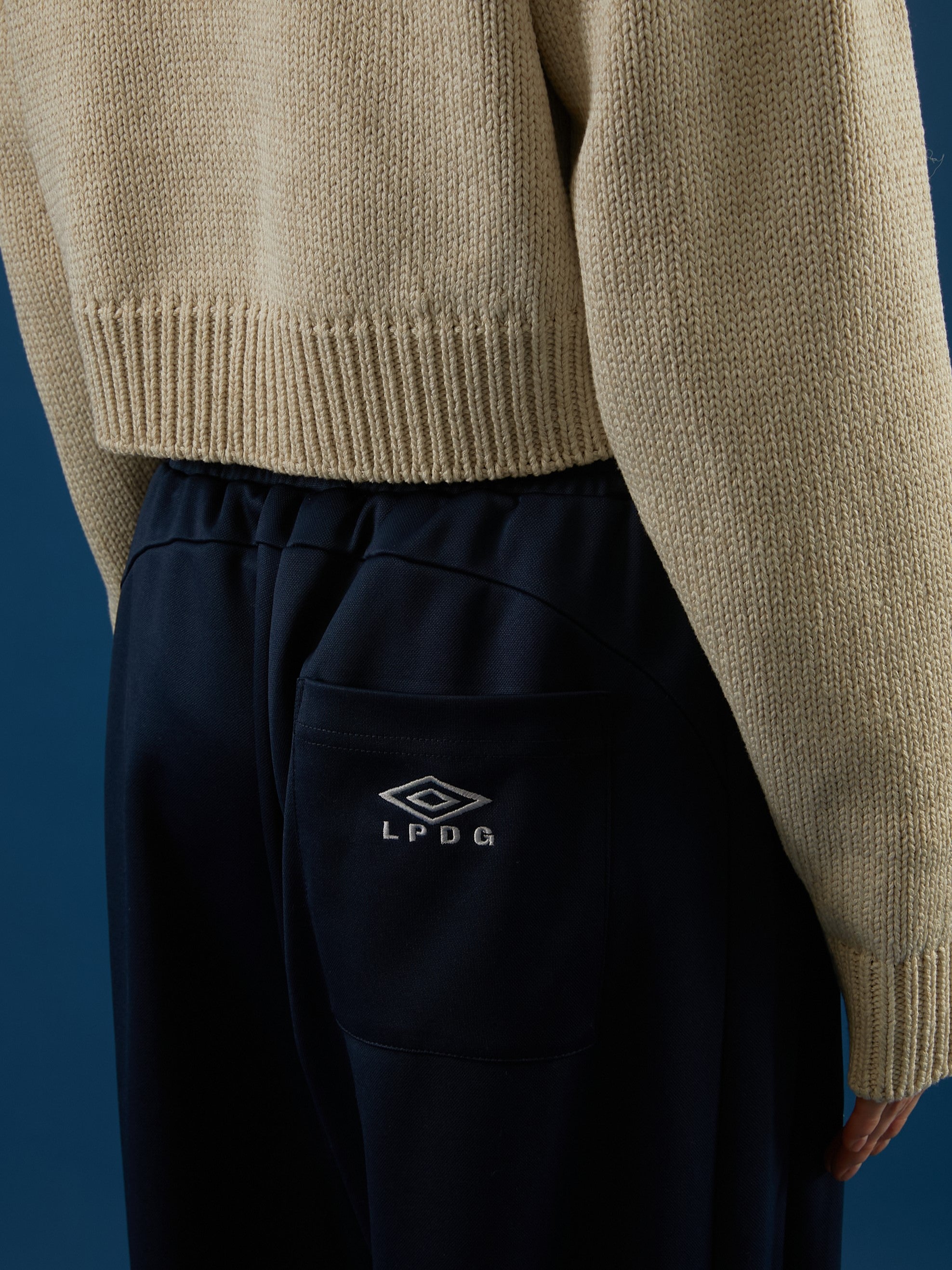 UMBRO×LA PEAU DE GEM The Urban Nomad track Pants