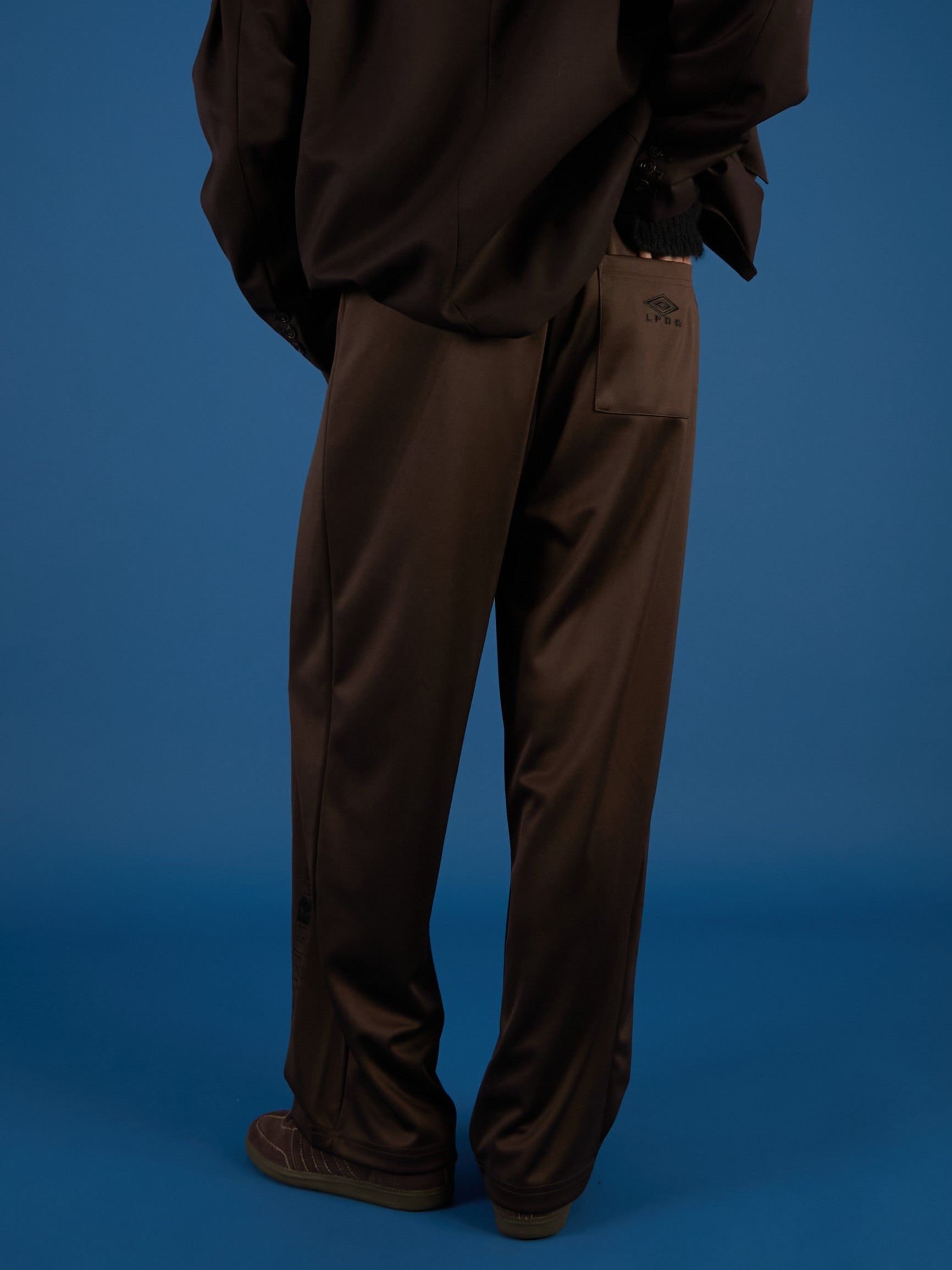 UMBRO×LA PEAU DE GEM パンツ 36サイズ ブラウン UMBRO×LA PEAU DE GEM The Urban Nomad track Pants