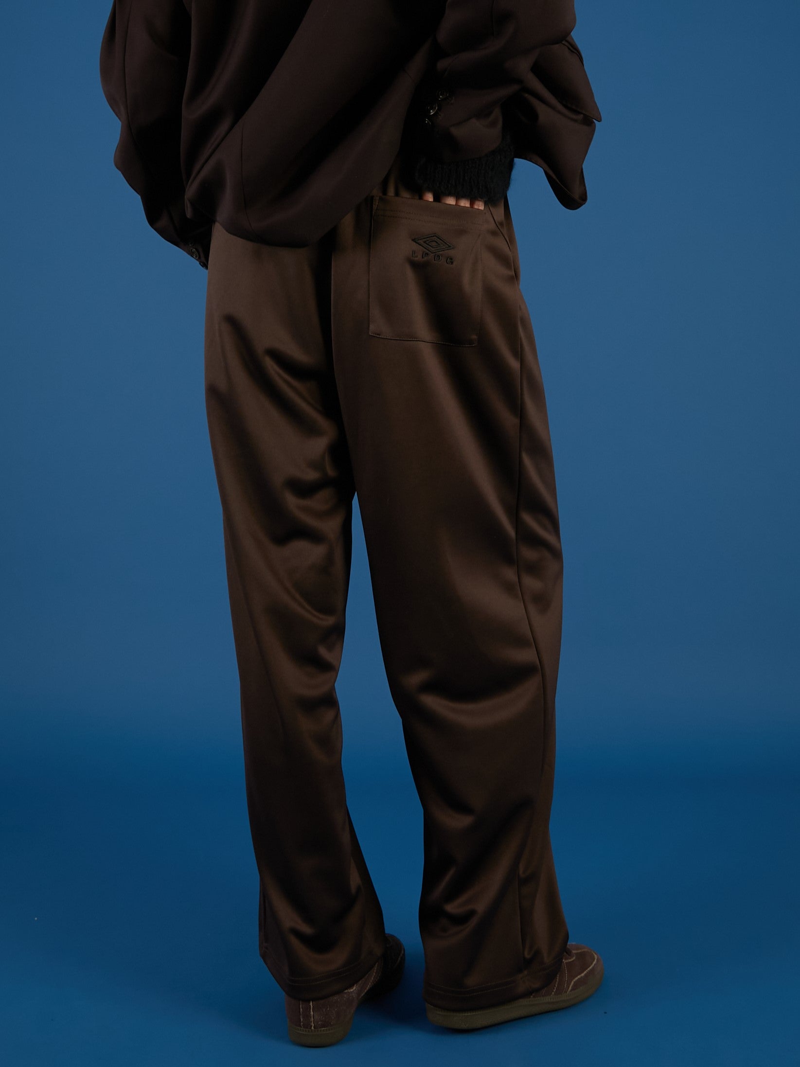 【新品タグ付】 UMBRO×LA PEAU DE GEM パンツ 36サイズ UMBRO×LA PEAU DE GEM The Urban Nomad track Pants